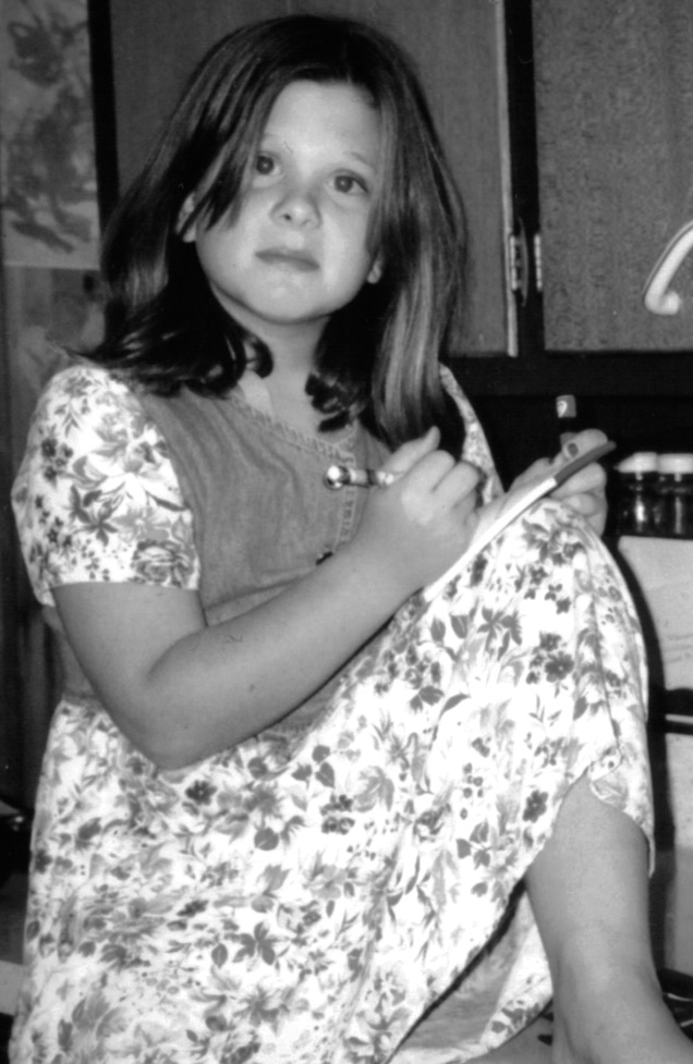 A black and white photograph of author Molly Mueller as a young girl